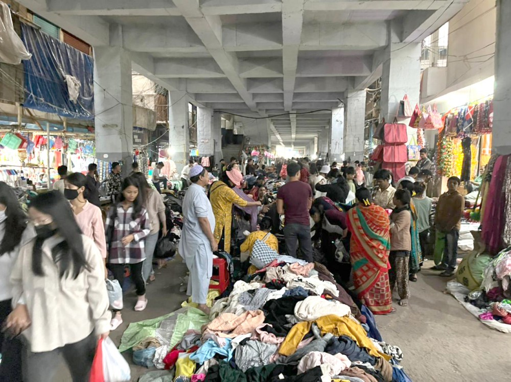 Citizens rummaging through the second-hand clothes at new shopping-cum-parking complex at New Market Dimapur. (Morung Photo)